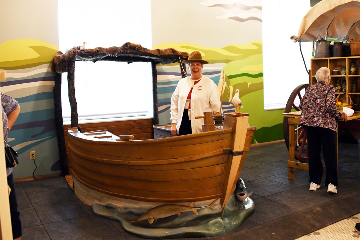 081 Marge Bredow in the Mackinaw Boat which was used by fur traders to navigate down the river.JPG